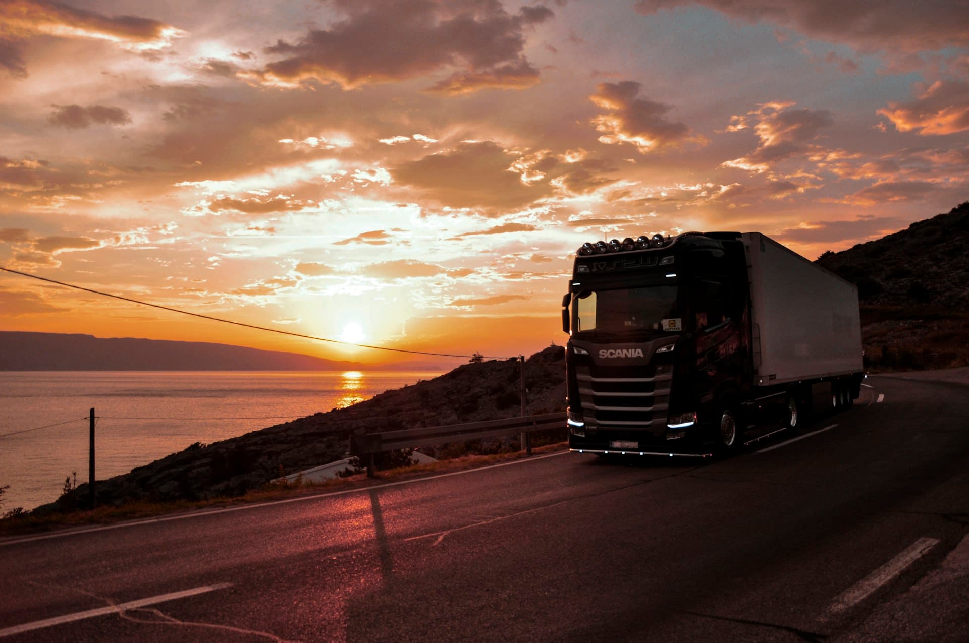 Freight truck on the highway at sunset